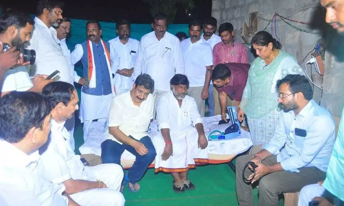 A group of Congress leaders comforting CLP leader Bhatti Vikramarkha who fell ill with sunstroke during his padayatra in Nalgonda district on Tuesday