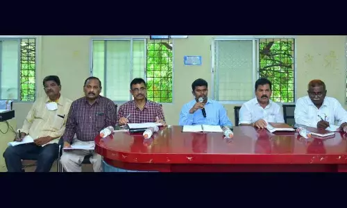 District Collector Arun Babu addressing the Spandana meeting in Puttaparthi.