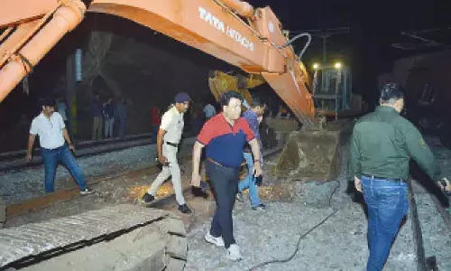 Divisional Railway Manager Anup Satpathy along with senior officials monitoring the relief works in the KK line on Monday