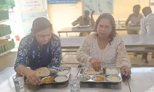 Foreigners enjoy food at Indira Rasoi