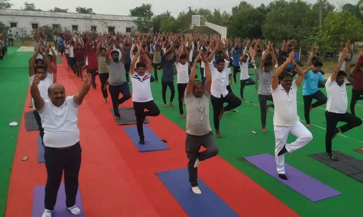 BJP AP President Somu Veerraju practicing Yoga at QISCET Ongole as part of celebrations of International Yoga Day on Wednesday morning