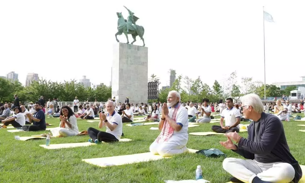 Prime Minister Narendra Modi performs yoga with others during the 9th International Day of Yoga celebrations at the UN headquarters, in New York on Wednesday