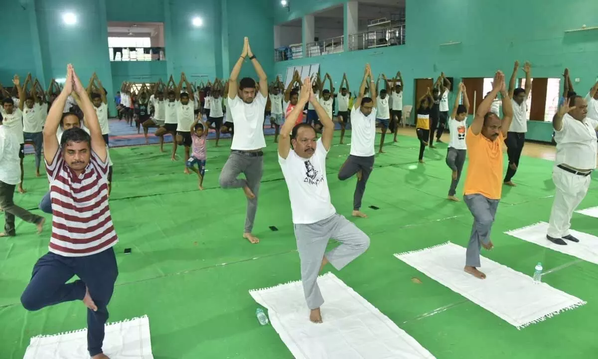 Participants performing yoga at Rajiv Gandhi Indoor stadium on Wednesday