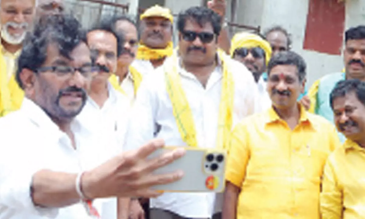 TDP leaders taking a selfie in front of TIDCO Houses in Chintala on Wednesday