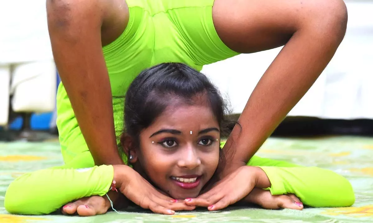 A girl performing yoga asana at International Yoga Day celebrations in Ongole on Wednesday