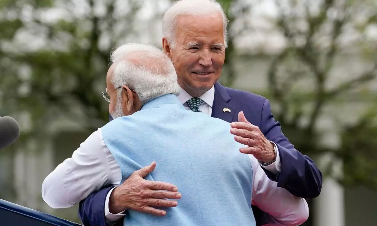 Prime Minister Narendra Modi embraces President Joe Biden during a State Arrival Ceremony on the South Lawn of the White House on Thursday