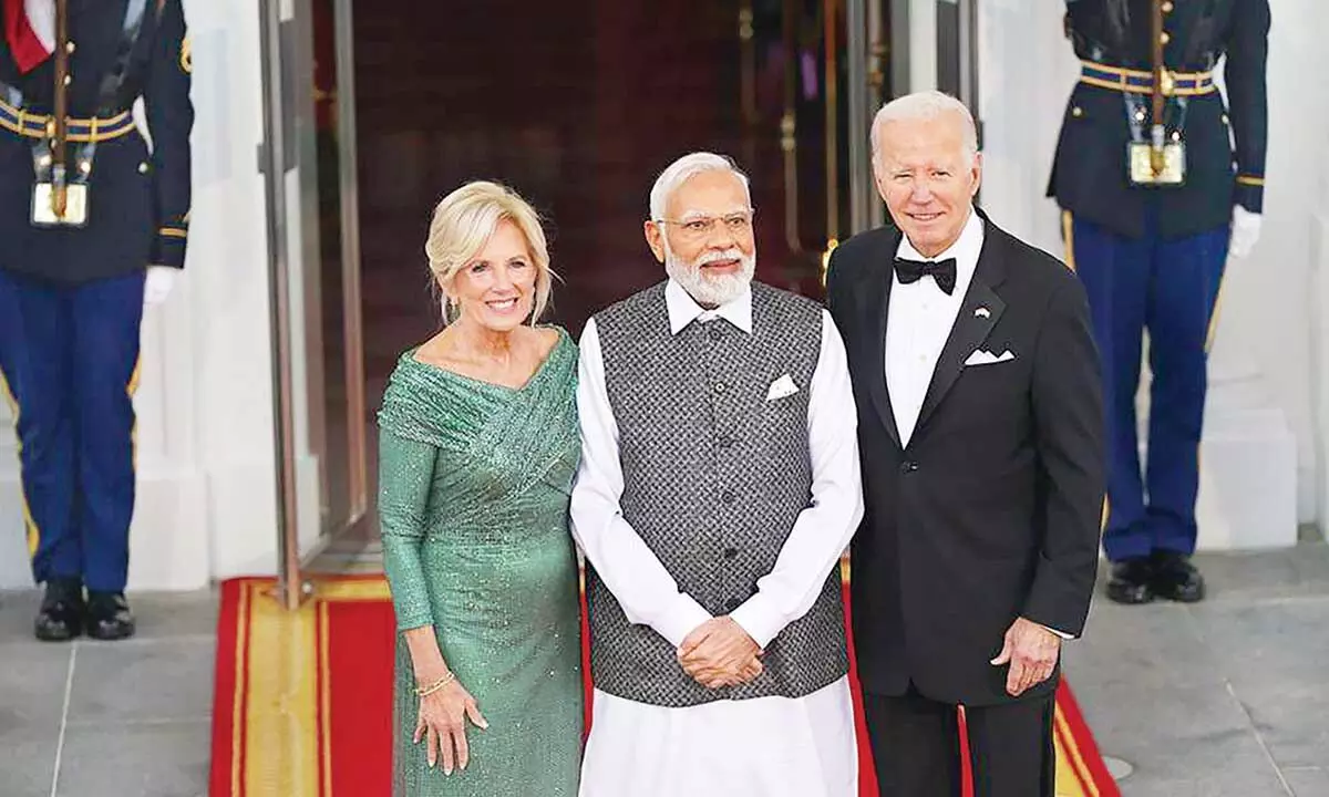 Prime Minister Narendra Modi being received by US President Joe Biden and First Lady Jill Biden upon his arrival for a State dinner, at the White House in Washington on Thursday