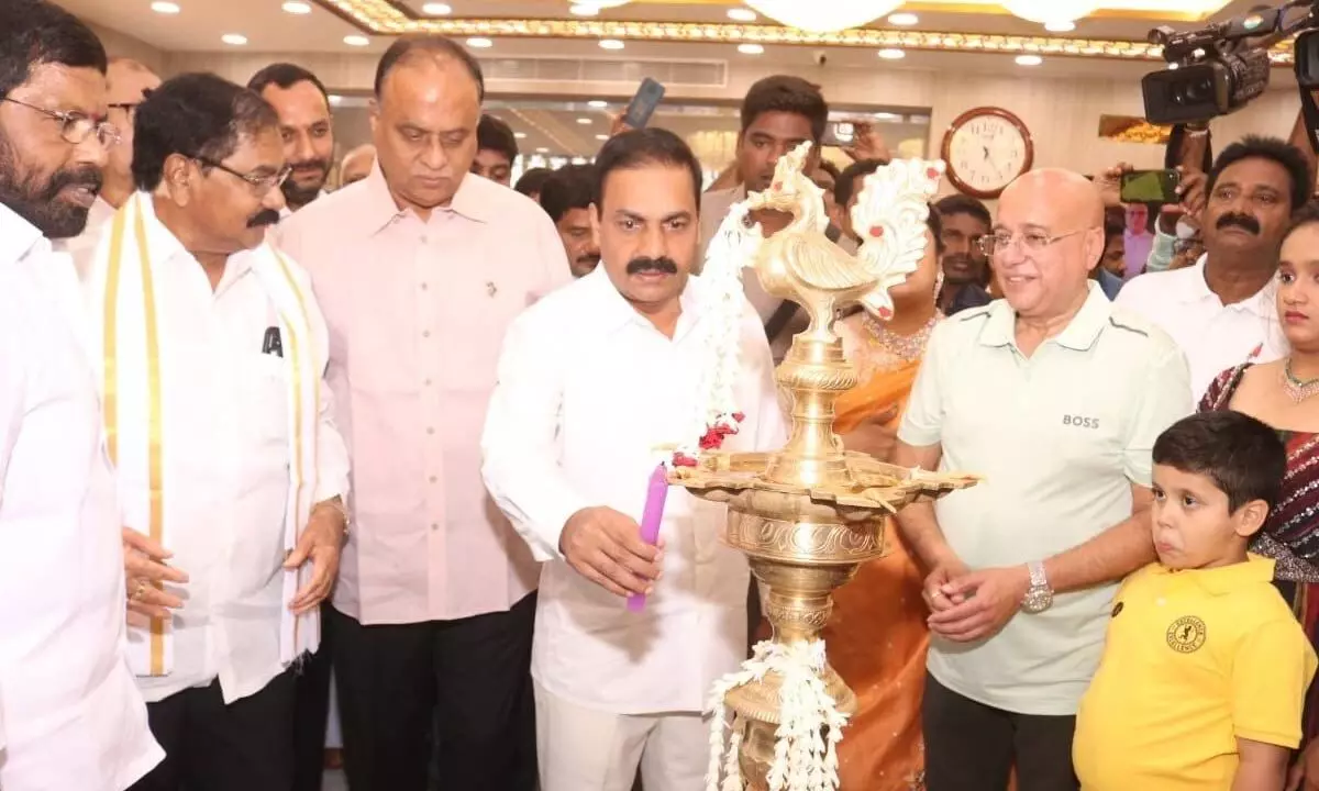 Agriculture Minister Kakani Govardhan Reddy lighting the lamp to mark the inauguration of Lalithaa Jewellery 50th showroom in Nellore on Saturday.