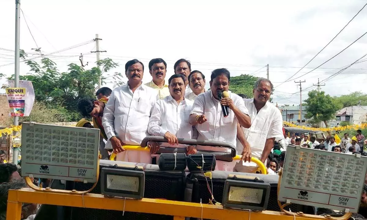 TDP politbureau member Kalava Srinivasulu and former Minister Palle Raghunath Reddy speaking from roof of bus in Puttaparthi on Saturday.