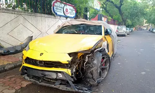 Lamborghini hits auto, 2 injured