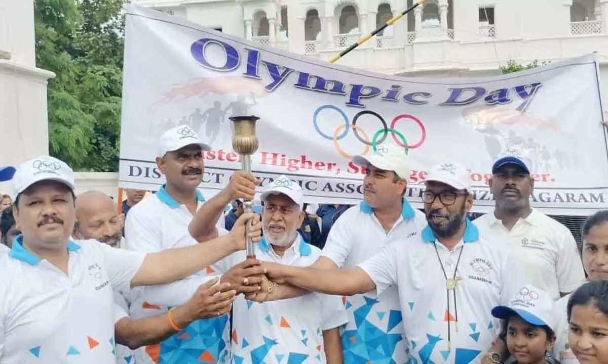 MLC P Raghu Varma and athletes at the inaugural function of the Olympic Run in Vizianagaram on Sunday