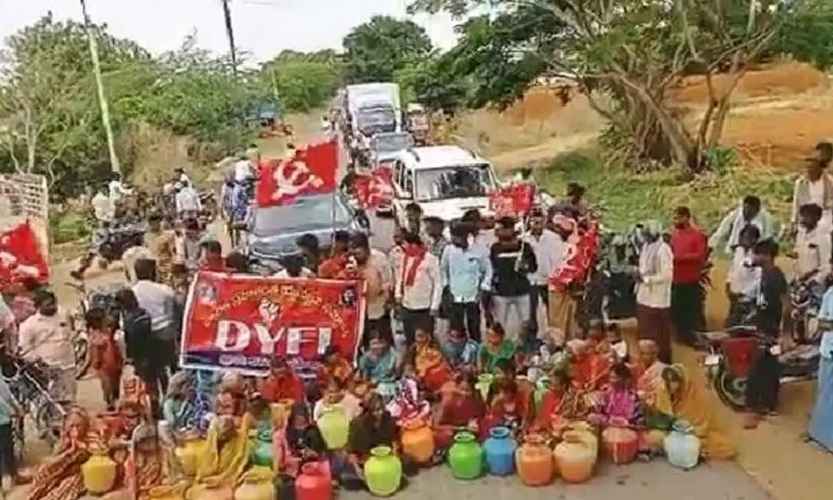 Ballekal villagers and CITU leaders staging a road blockade with empty pots on Madhavaram and Adoni road demanding the officials to resolve the drinking water problem on Monday