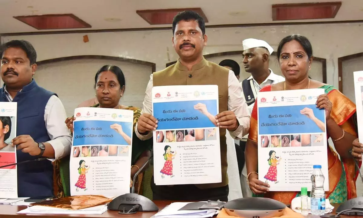 NTR district Collector S Dilli Rao releasing poster on eradication of leprosy, at his office in Vijayawada on Monday