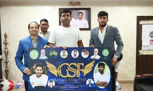 IT Minister Gudivada Amarnath launching a poster of the job fest to be held in Visakhapatnam next month