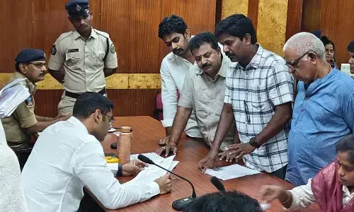 JSP corporator P Murthy Yadav submitting a petition to Joint Collector K S Viswanathan in Visakhapatnam on Monday
