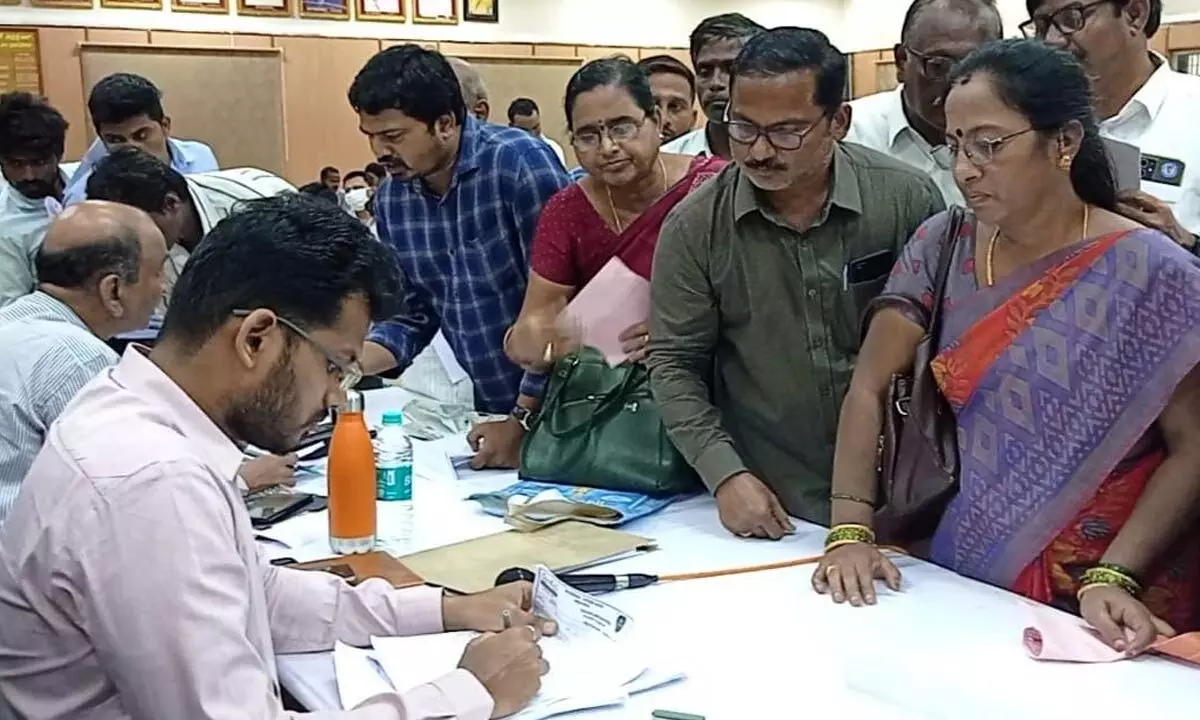 STU leaders registering a complaint with the joint collector  M Naveen on anomalies in teachers’ transfers