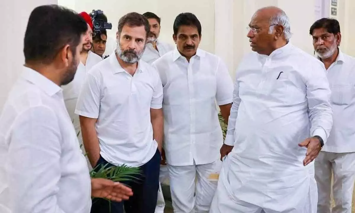Congress president Mallikarjun Kharge with party leader Rahul Gandhi and Telangana Congress president Revanth Reddy (left) during a meeting at the AICC headquarters, in New Delhi on Tuesday