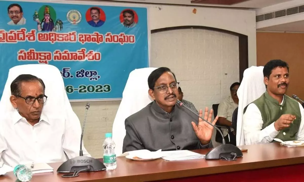 AP Official Language Commission Chairman P Vijaya Babu speaking at a meeting at the  Collectorate in Vijayawada on Tuesday