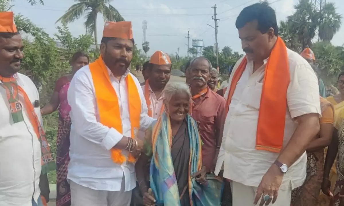 BJP leader Ponguleti Sudhkar Reddy interacting with people at Narayanapuram village in Khammam district on Tuesday