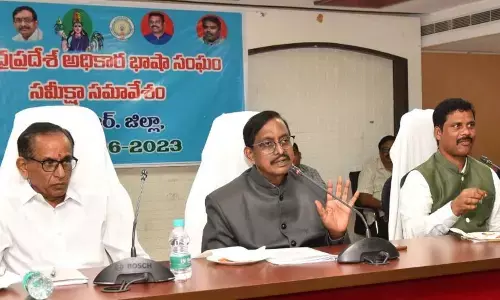 AP Official Language Commission Chairman P Vijaya Babu speaking at a meeting at the  Collectorate in Vijayawada on Tuesday