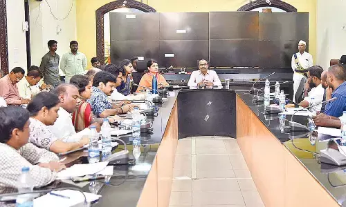 District Collector M Venugopal Reddy addressing a review meeting at Guntur Collectorate on Tuesday. Joint Collector G Rajakumari is also seen.