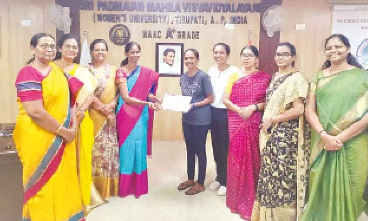 SPMVV V-C Prof D Bharathi presenting certificate to a student of UMT in Tirupati on Wednesday. Registrar Prof N Rajini, Dean Prof N Vijaya Lakshmi and others are seen.