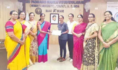 SPMVV V-C Prof D Bharathi presenting certificate to a student of UMT in Tirupati on Wednesday. Registrar Prof N Rajini, Dean Prof N Vijaya Lakshmi and others are seen.