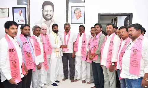 Minister Srinivas Goud welcoming BJP leader Nambi Venugopal Yadav and his followers from  Hanwada mandal into BRS fold in Mahabubnagar on Wednesday