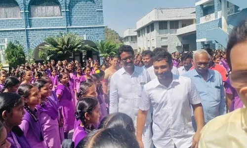 Ex-cricketer Ambati Rayudu interacts with children in a school at Mutlur village of Vatticherukuru mandal in Guntur district on Wednesday