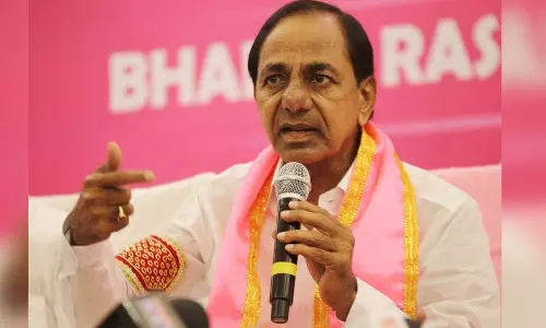 CM KCR distributes Pattas of Podu lands Asks police to withdraw cases on tribals