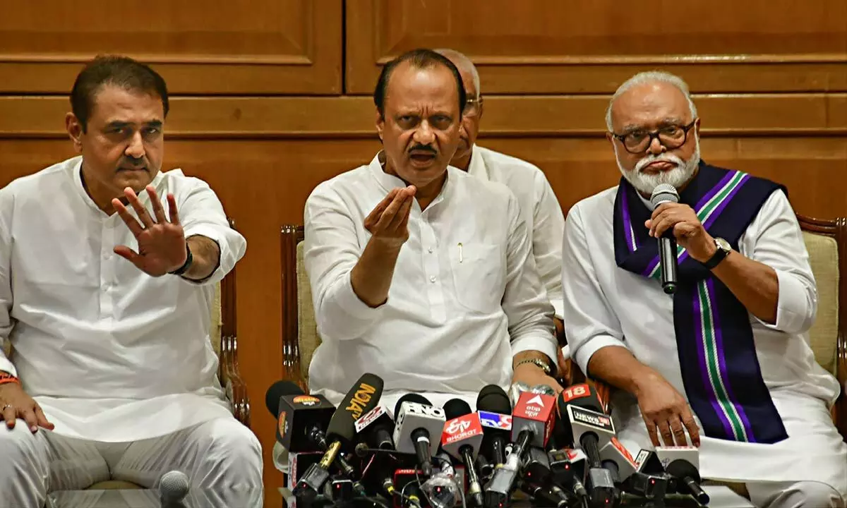 Newly sworn-in Maharashtra Deputy CM Ajit Pawar with NCP leaders Chhagan Bhujbal and Praful Patel during a press conference, in Mumbai on Sunday