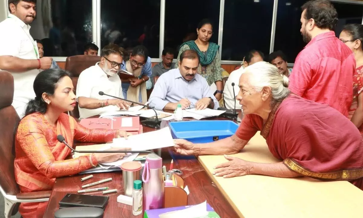 Municipal Commissioner D Haritha and other officials at the Spandana programme held in Tirupati on Monday.  Commissioner was seen receiving a petition from an old woman.