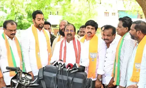 BJP State president Somu Veerraju addressing the media at Avadutha Tapovan Trust lands site in Vijayawada on Monday