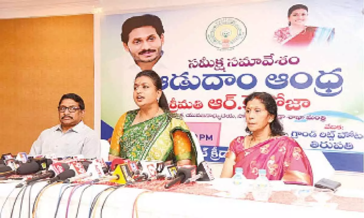 Minister for  Tourism and Sports R K Roja speaking to the media in Tirupati on Wednesday. SAAP MD Harshavardhan and Principal Secretary (Sports) Vani Mohan are also seen.