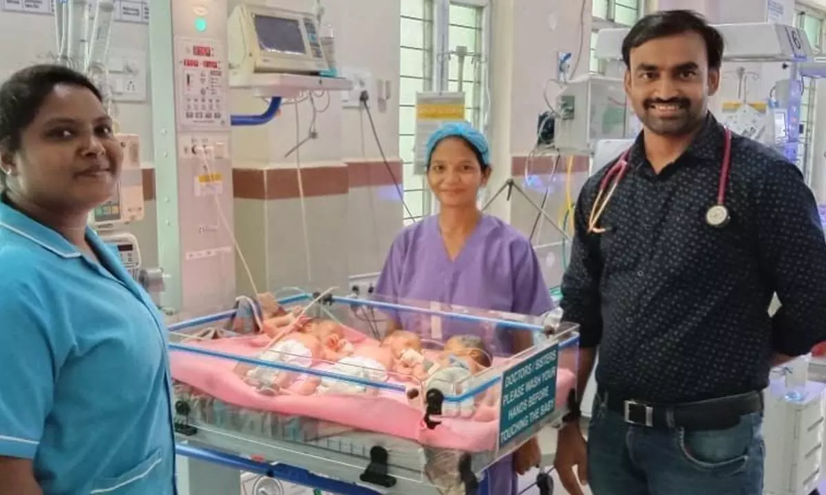 The doctors showing three babies born to a woman at Area Hospital Bhadrachalam on Wednesday