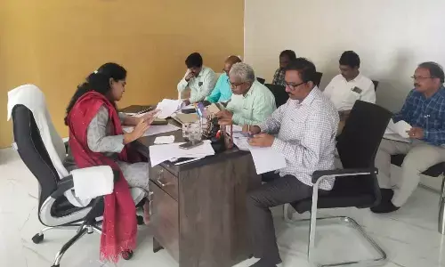 GMC Commissioner Kirthi Chekuri addressing a review meeting at her chamber in Guntur on Wednesday