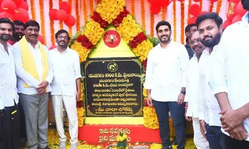 TDP national general secretary Nara Lokesh unveils a plaque on completion of 1,900 kilometres of his Yuva Galam Padayatra at Saluchinthala in Kovur Assembly constituency on Wednesday