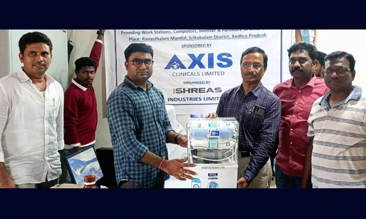 Aurobindo company representatives handing over water purifier to the mandal revenue office at Ranastalam on Friday