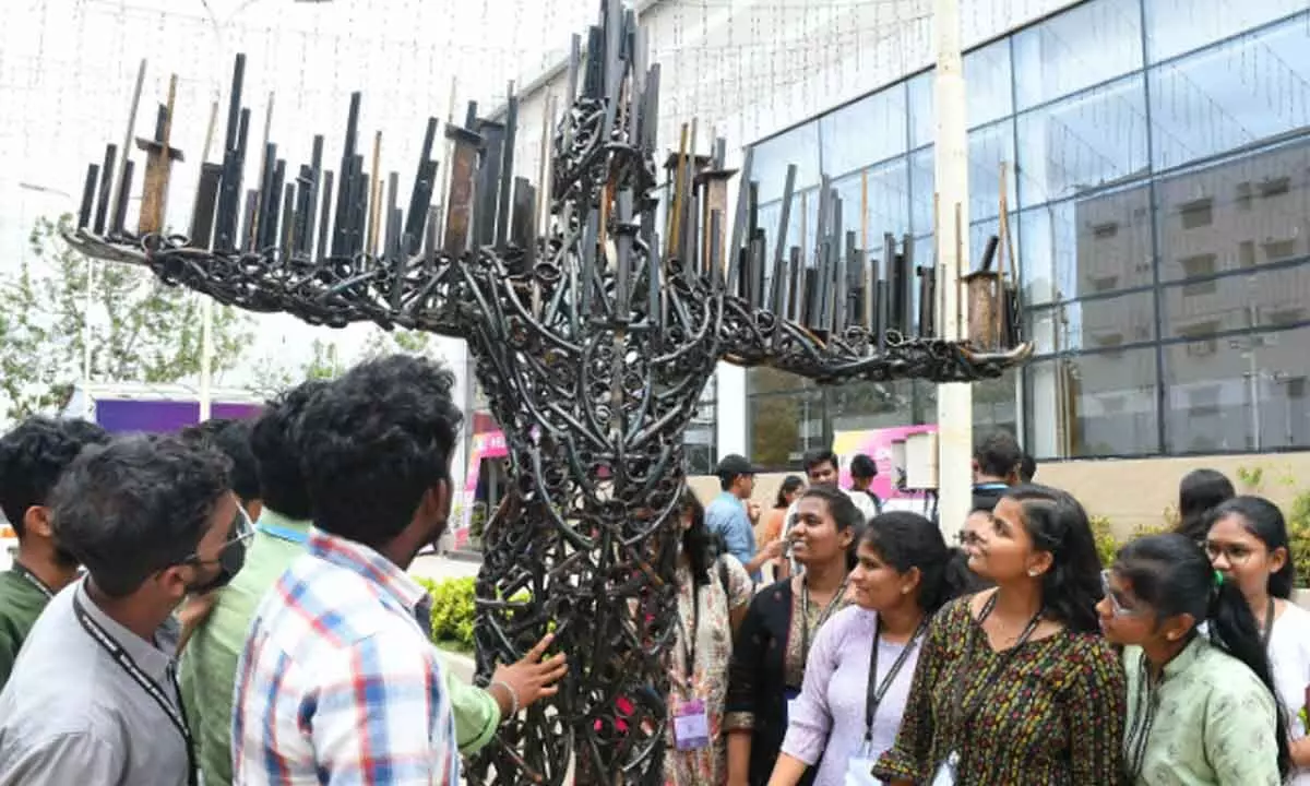 Students viewing a structure at the exhibition