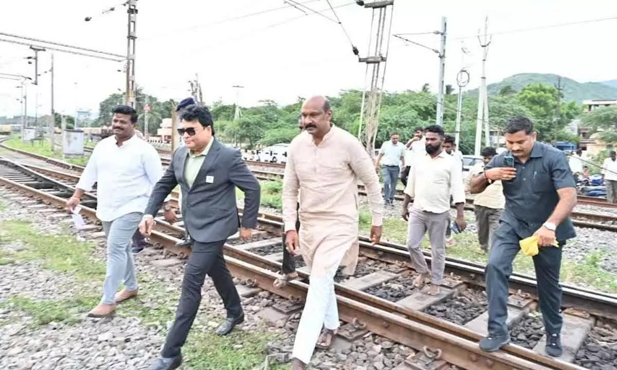 Divisional Railway Manager Anup Satpathy  interacting   with west constituency MLA PGVR Naidu and locals at Simhachalam railway station in Visakhapatnam on Friday