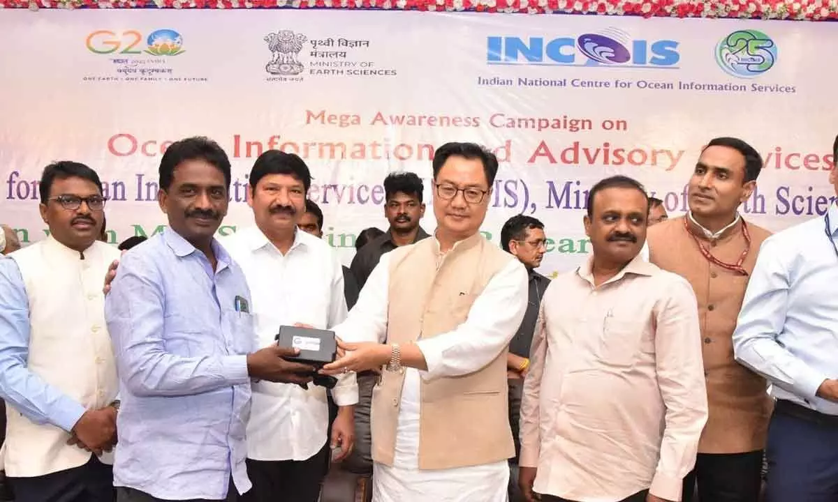 Union Minister for Earth Sciences Kiren Rijiju handing over INCOIS devices to fishermen in  Machilipatnam on Friday. Minister Jogi Ramesh, MP Balashowry and Krishna District Collector  P Raja Babu are also seen.