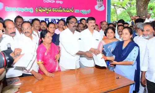 Minister Puvvada Ajay Kumar distributing license forms to youth after launching a free license mela at Khammam on Saturday
