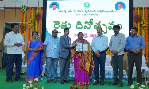 Principal Secretary (Agriculture Marketing and Cooperation) Chiranjeevi Chowdary and ANGRAU Vice-Chancellor Dr A Vishnuvardhan Reddy felicitating innovative woman farmer K Jaya at the Farmers’ Day celebrations held at  ANGRAU on Saturday