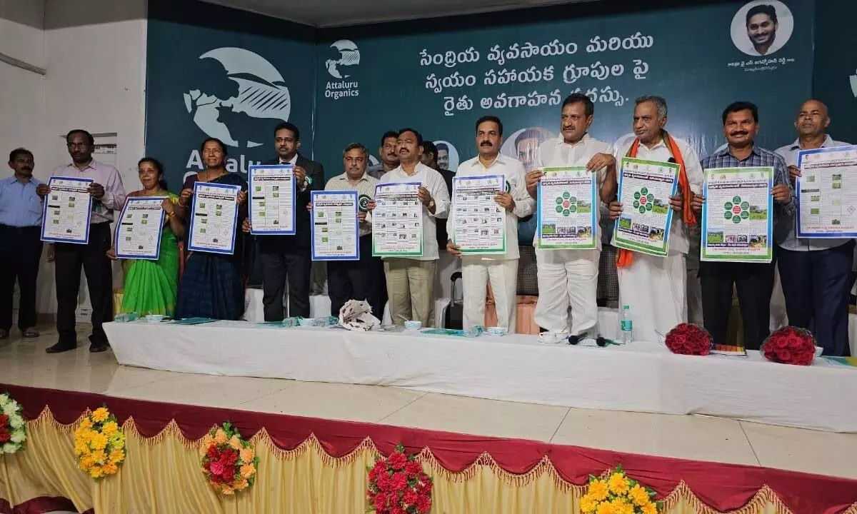 Agriculture Minister Kakani Govardhan Reddy, MLA Namburu Shankara Rao and Joint Collector Syam Prasad releasing posters relating to nature farming at Attaluru village on Monday