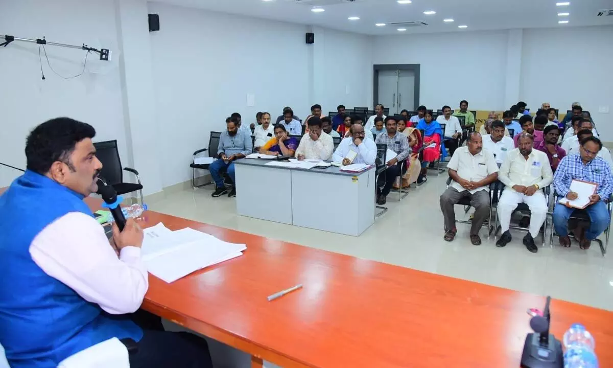 Bapatla district Collector Ranjit Basha addressing a meeting in Narasaraopet on Monday