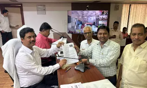 Kakani Aashaya Sadhana Samithi president Kakani Tarun Kumar and others submitting a representation to district Collector S Dilli Rao in Vijayawada on Monday