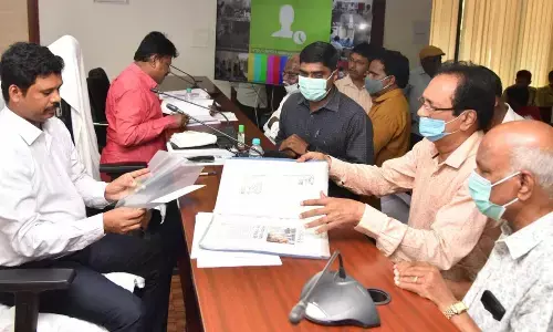 NTR district Collector S Dilli Rao receiving petitions from people during Spandana programme at Pingali Venkayya meeting hall in Vijayawada on Monday