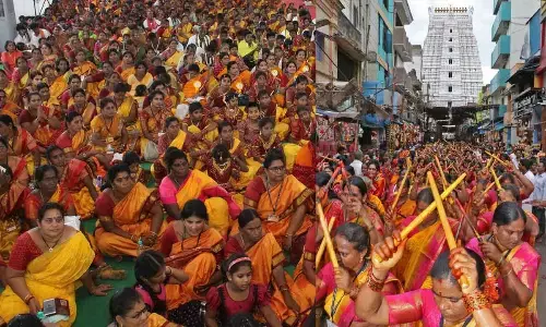 Women members of Bhajan mandals marching in a procession (Shoba Yatra) as part of Metlotsavam in Tirupati on Monday.