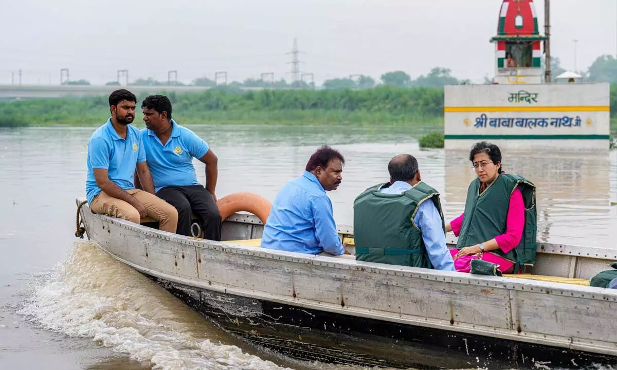 Delhi Education and PWD Minister Atishi inspects the water level of Yamuna river in New Delhi on Monday