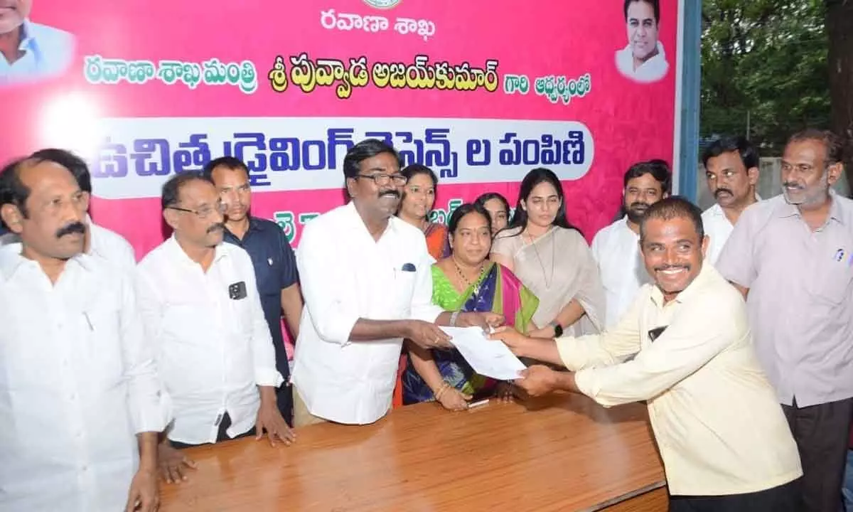 Minister for Transport Puvvada Ajay Kumar handing over LLRs to the youth, at his camp office in Khammam on Monday